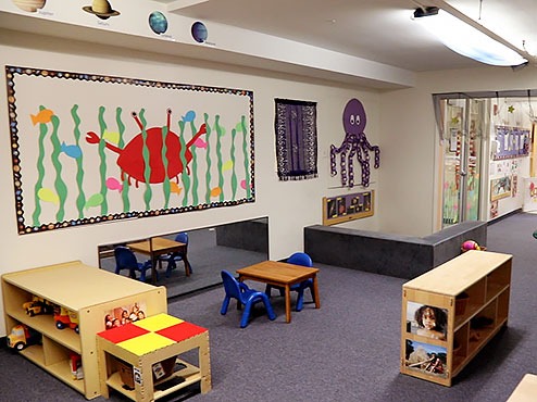 Carlow’s Early Learning Center has large, colorful murals and many toys neatly tucked away in shelves.