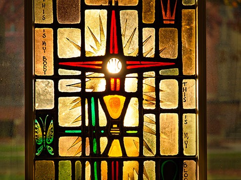 A stained-glass window symbolizes Carlow’s vision and mission.