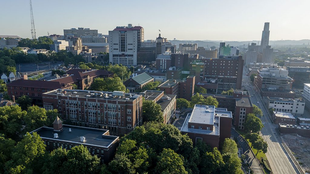An aerial view of the tree-lined Carlow campus looking toward the University of Pittsburgh.