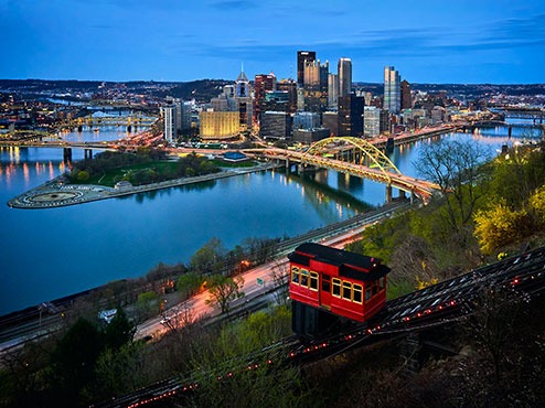 Downtown Pittsburgh is seen at twilight with the Duquesne Incline in the foreground.