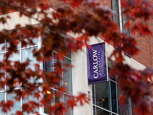 Carlow University banners hanging from the exterior of the University Commons.