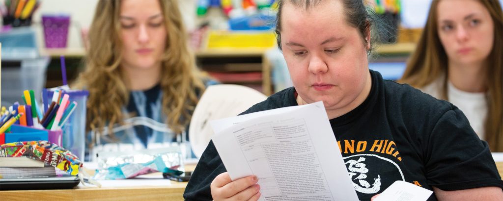Bachelor of Arts in Special Education: Woman reading piece of paper