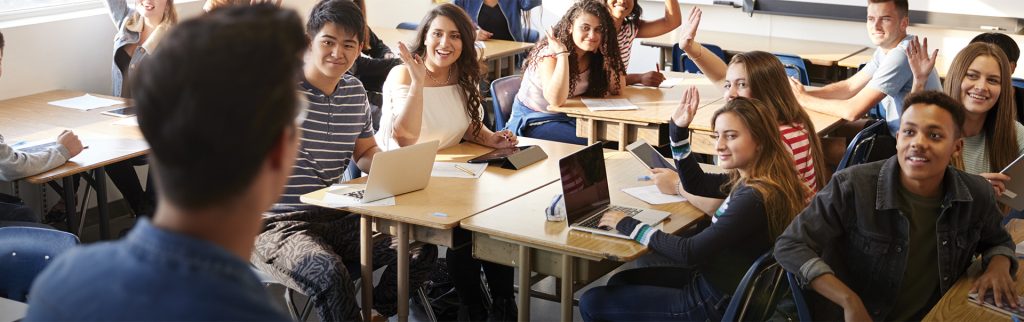 Secondary Education Alum teaching a class full of students