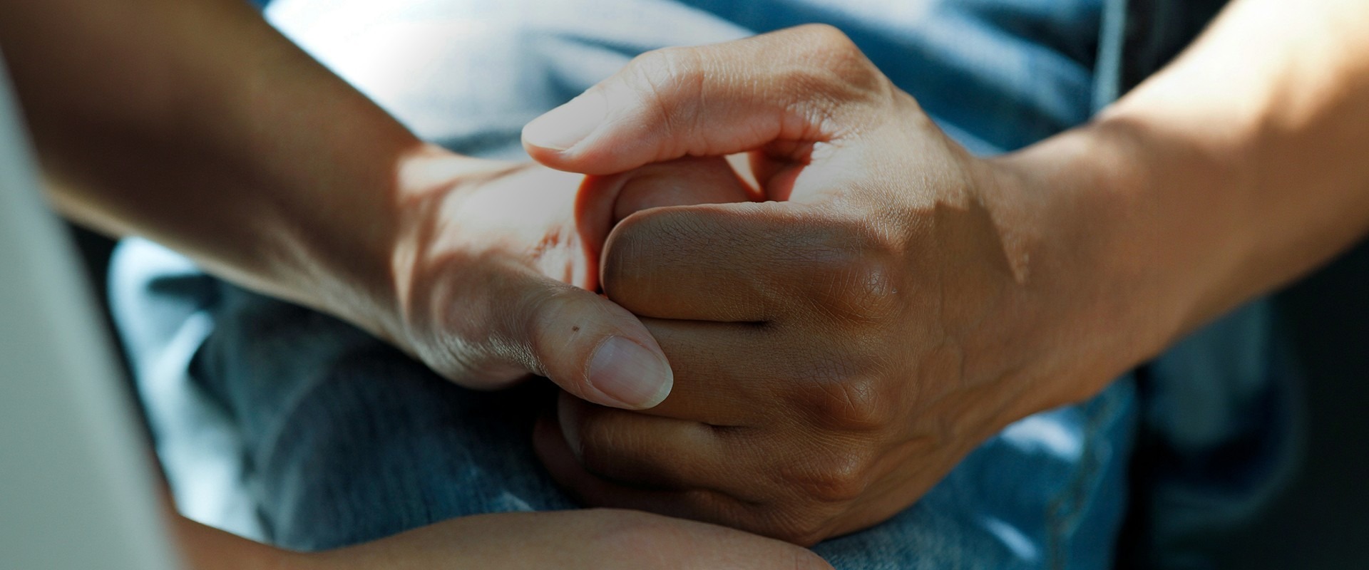 Two people holding hands