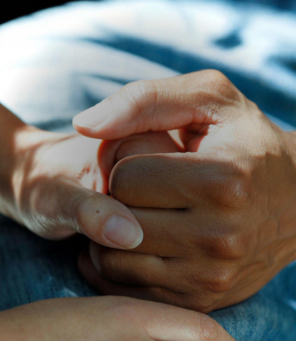 Two people holding hands