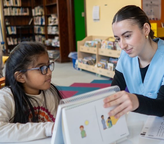 Carlow student tutoring a young child
